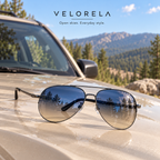VELORELA Gunmetal aviator sunglasses with blue-yellow lenses on parked SUV hood