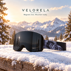Velorela Gray / Space Cat magnetic snow goggles with the matching black frame and printed strap in an alpine snow scene
