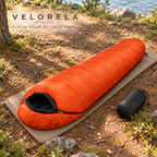Bright Orange mummy sleeping bag with black carry sack