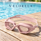 Pink goggles on a wooden pool deck
