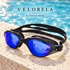 Velorela adult swimming goggles, Black / Blue, photographed at poolside.