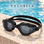 Velorela adult swimming goggles, Black / Smoke, photographed at poolside.