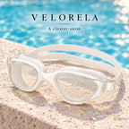 Velorela adult swimming goggles, White / Clear, photographed at poolside.
