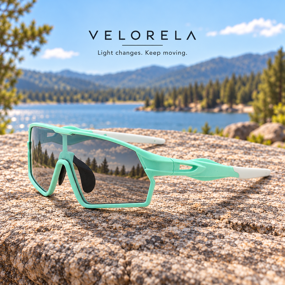 Velorela Mint Green photochromic sports sunglasses resting entirely on a lakeside granite rock