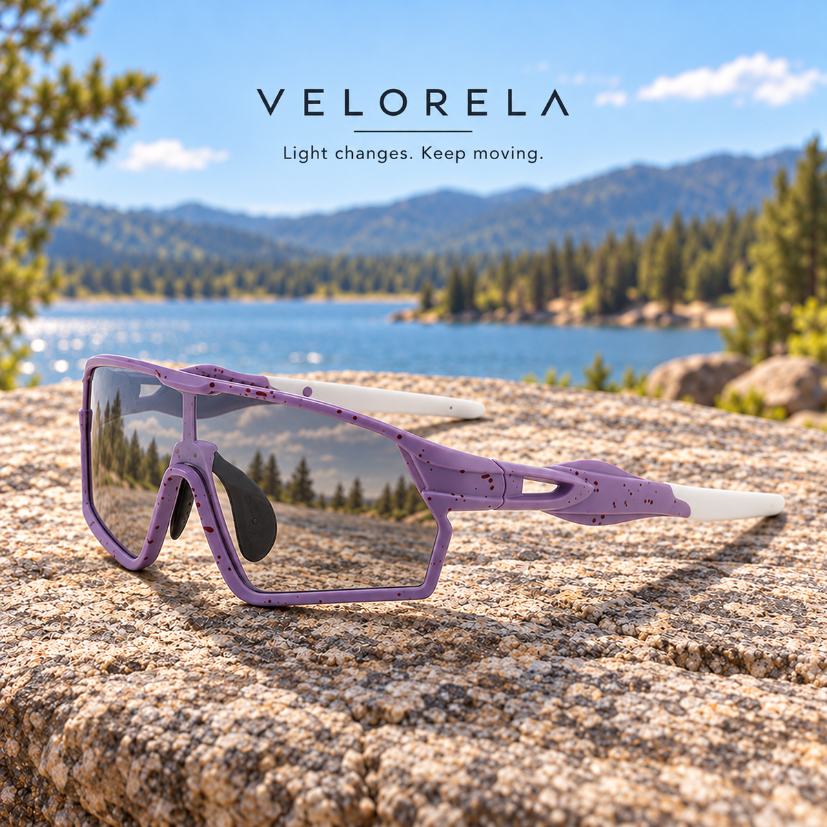 Velorela Purple photochromic sports sunglasses resting entirely on a lakeside granite rock